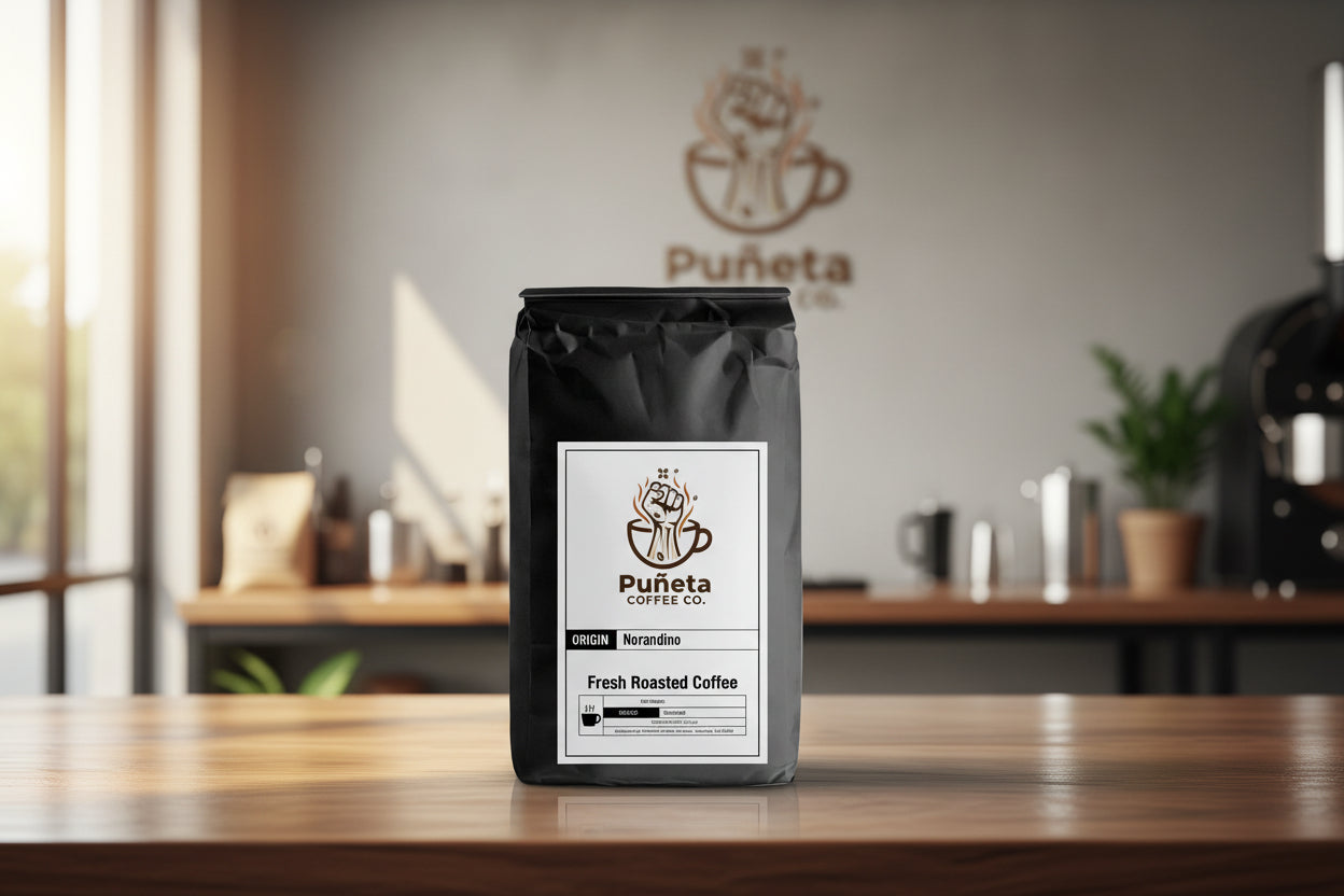 Puénta coffee bag on a wooden table with a blurred cafe background