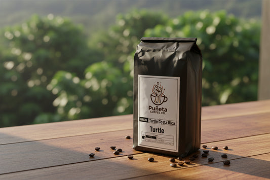 Black coffee bag with Puánta Coffee Co. label on a white background